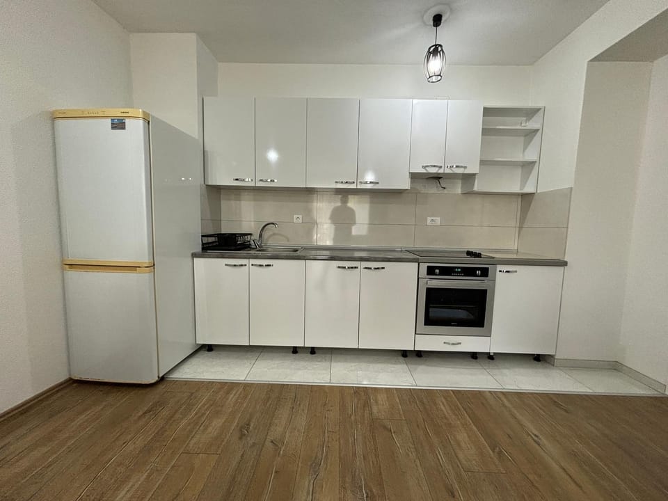 Kitchen or kitchenette, dishwasher, oven, stove