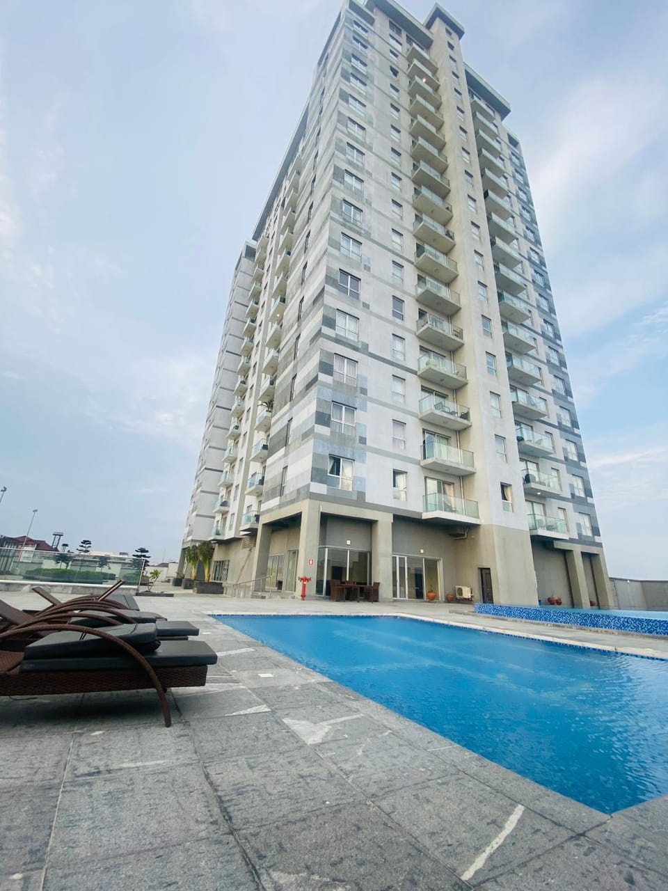 Property building, Day, Pool view, Swimming pool, sunbed