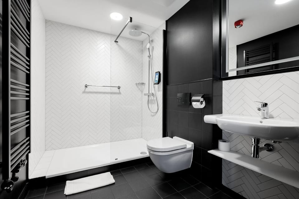 Shower, Toilet, Bathroom, hair dryier, towels