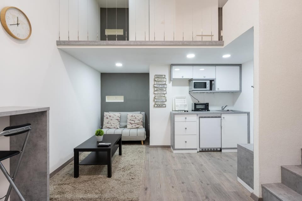 Kitchen or kitchenette, Living room, Seating area, Dining area, furniture, microwave, minibar, oven, stove, toaster