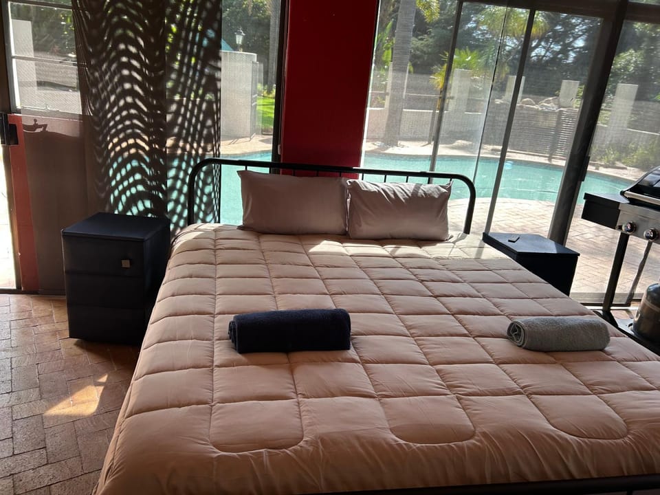 Bed, Pool view, towels