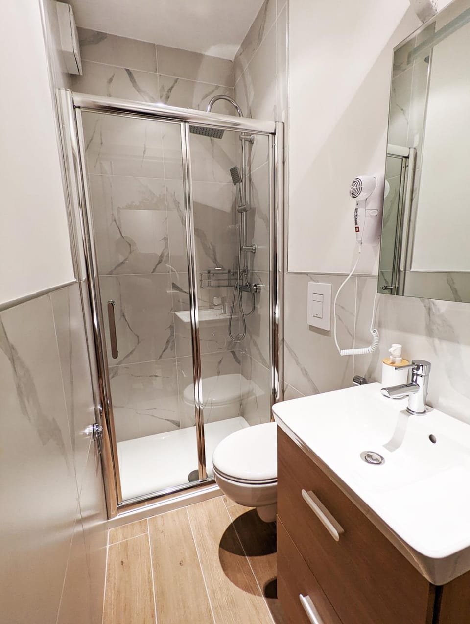 Shower, Toilet, Bathroom, hair dryier, towels