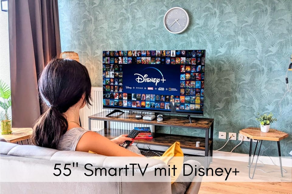 TV and multimedia, Living room, Seating area, Evening entertainment, Text overlay