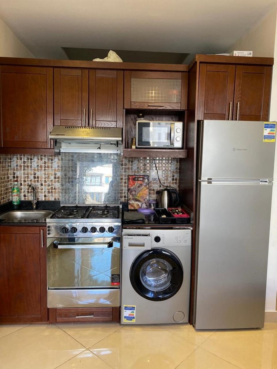 Kitchen or kitchenette, oven, stove, washing machine