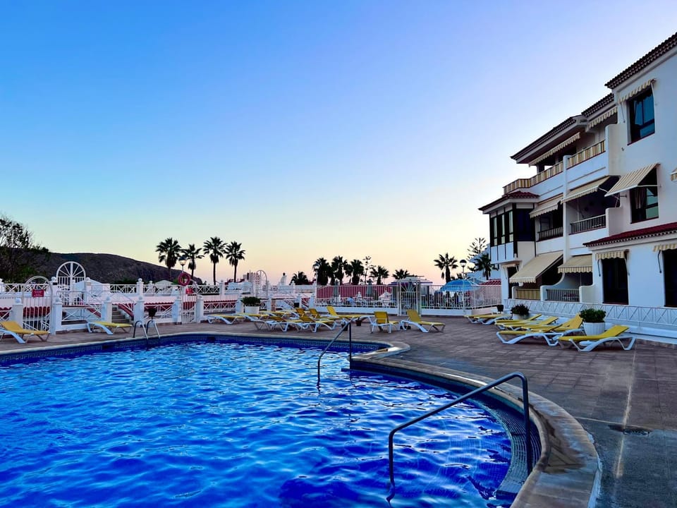 Property building, Natural landscape, Pool view, Swimming pool, sunbed