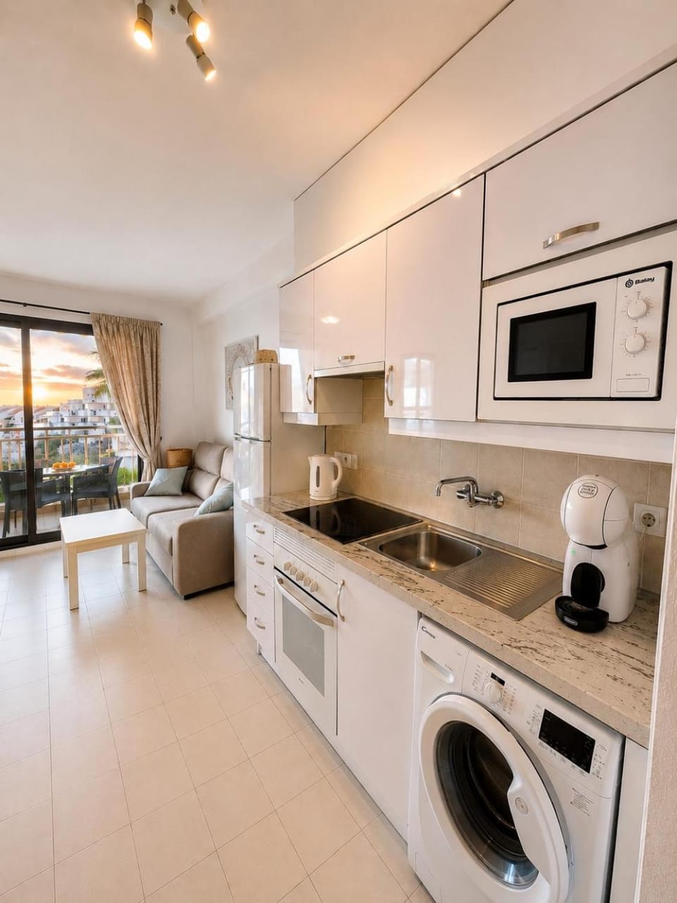 Kitchen or kitchenette, oven, stove, toaster, washing machine