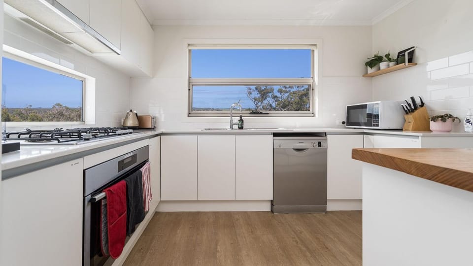 Kitchen or kitchenette, dishwasher, oven, stove, toaster