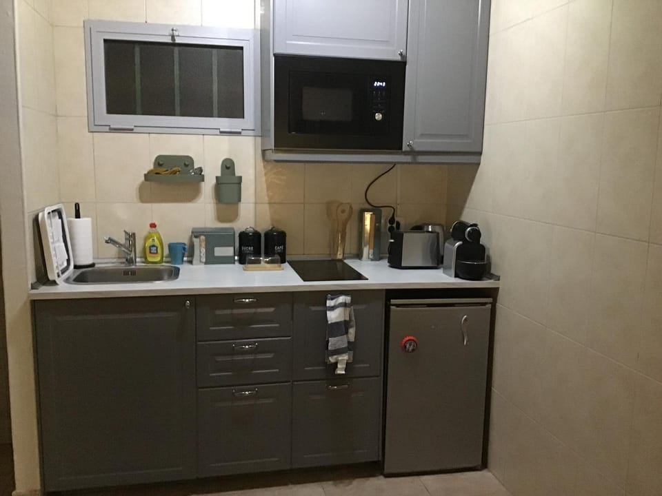 Kitchen or kitchenette, stove