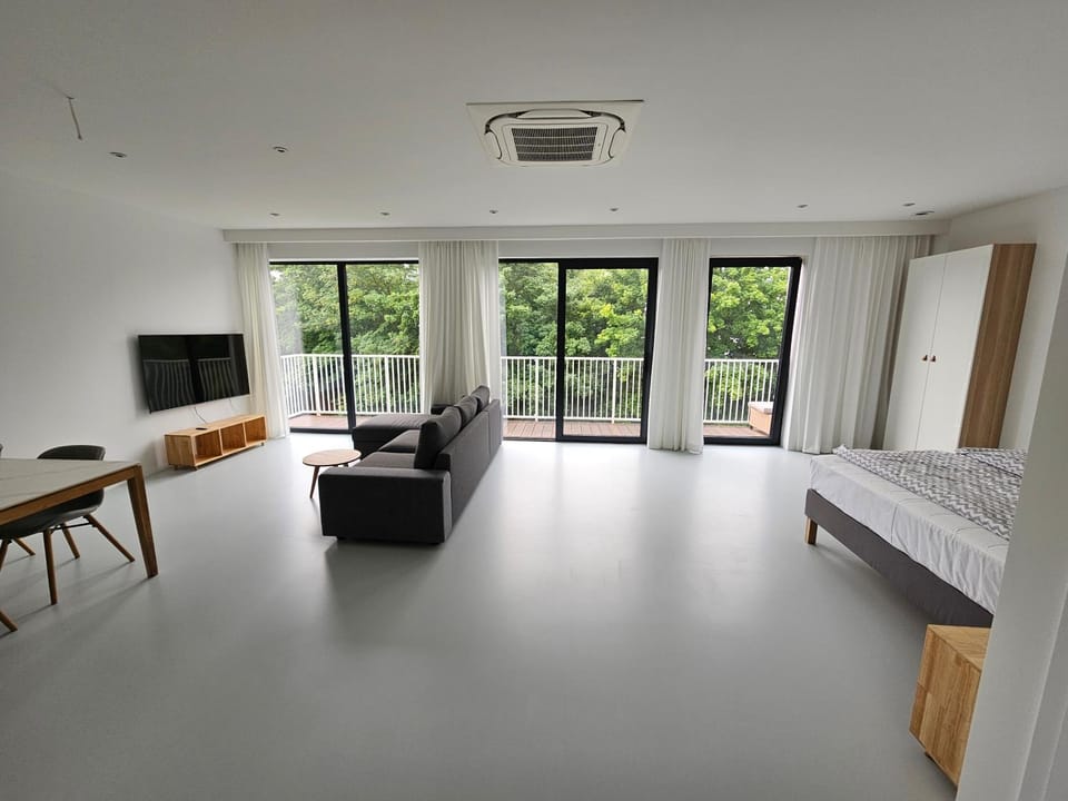 Bed, Living room, Seating area, Bedroom