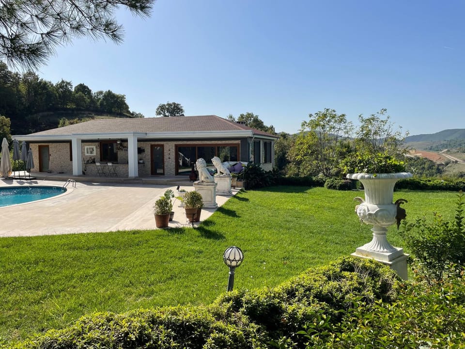 Property building, Patio, Day, Natural landscape, Garden, Garden view, Pool view, Swimming pool