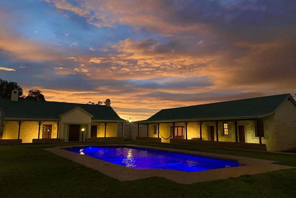 Property building, Swimming pool, Sunset