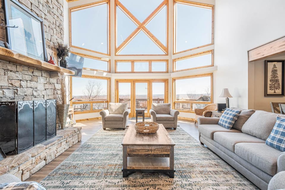 View (from property/room), Living room, Seating area, Lake view, fireplace, furniture