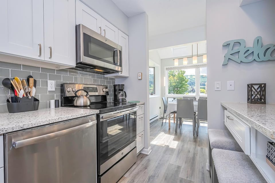 Kitchen or kitchenette, Seating area, Dining area, furniture, microwave, oven, stove