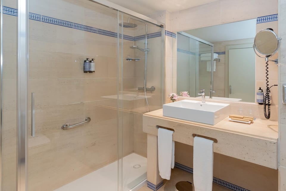 Shower, Bathroom, hair dryier, towels