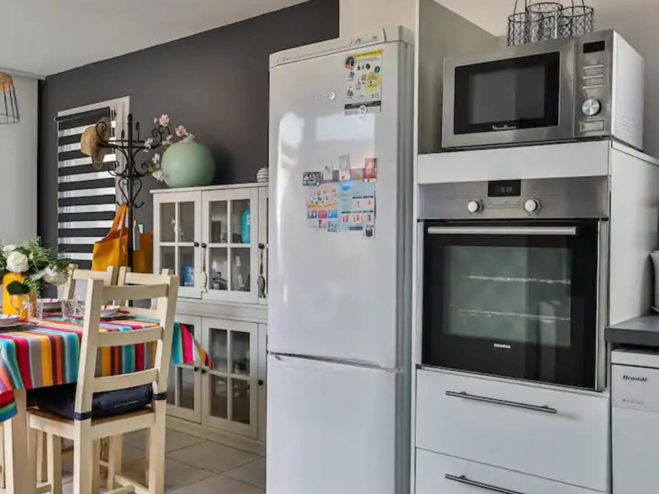 Kitchen or kitchenette, dishwasher, oven, stove