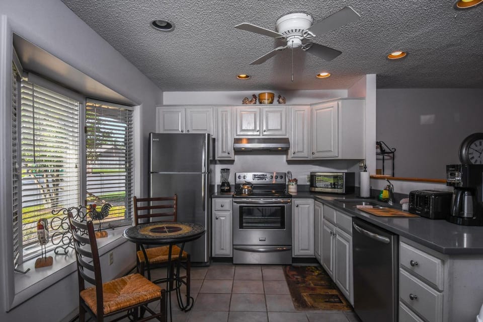 Kitchen or kitchenette, Seating area, furniture, microwave, oven, stove, toaster