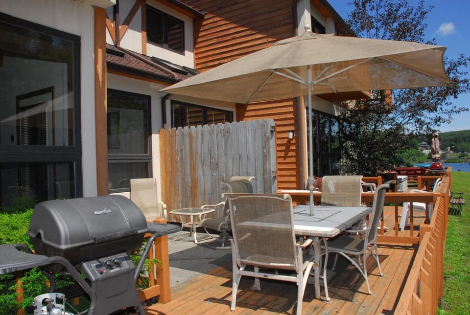 Property building, Patio, BBQ facilities, Garden, Seating area, Pool view, River view