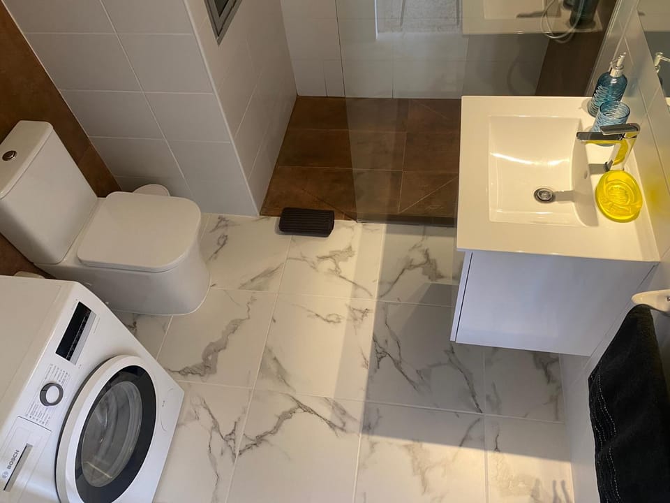 Shower, Toilet, Bathroom, towels, washing machine, dryer