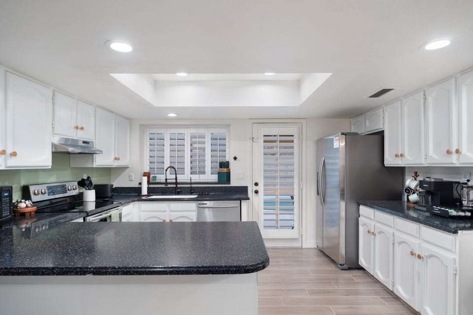 Kitchen or kitchenette, dishwasher, oven, stove, toaster