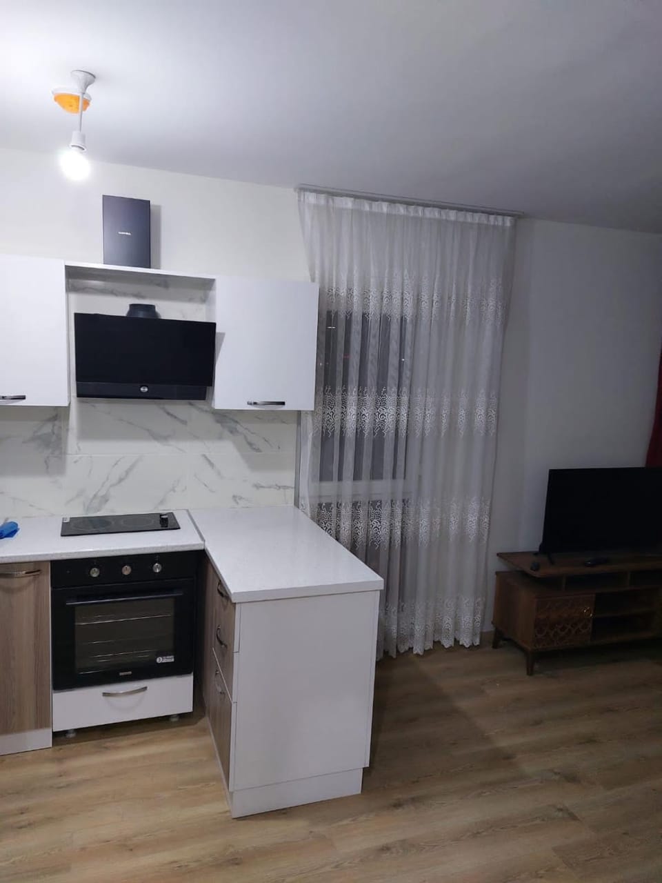 Kitchen or kitchenette, dishwasher, oven, stove
