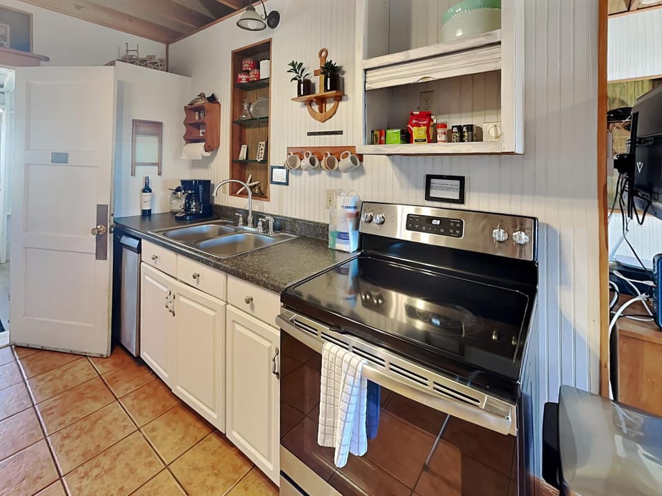 Kitchen or kitchenette, furniture, oven, stove, towels, kitchen