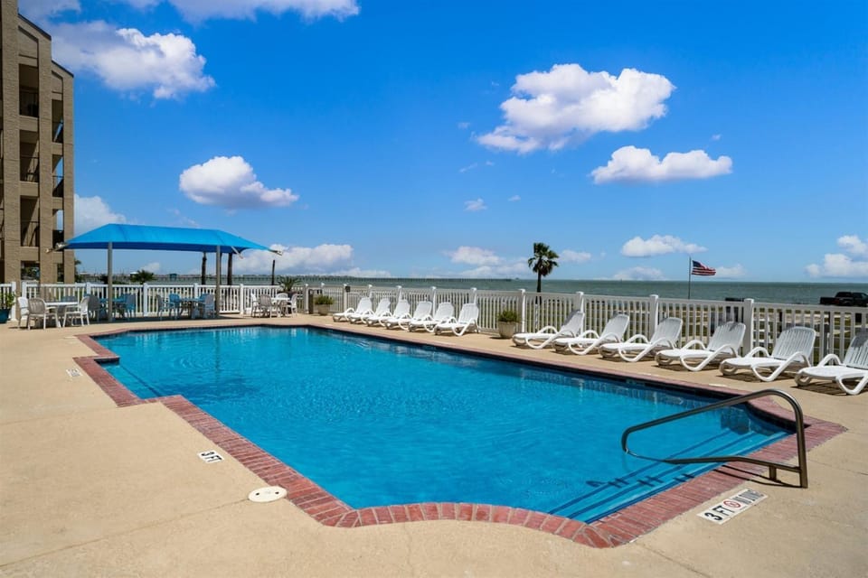Property building, Patio, Seating area, Sea view, Swimming pool