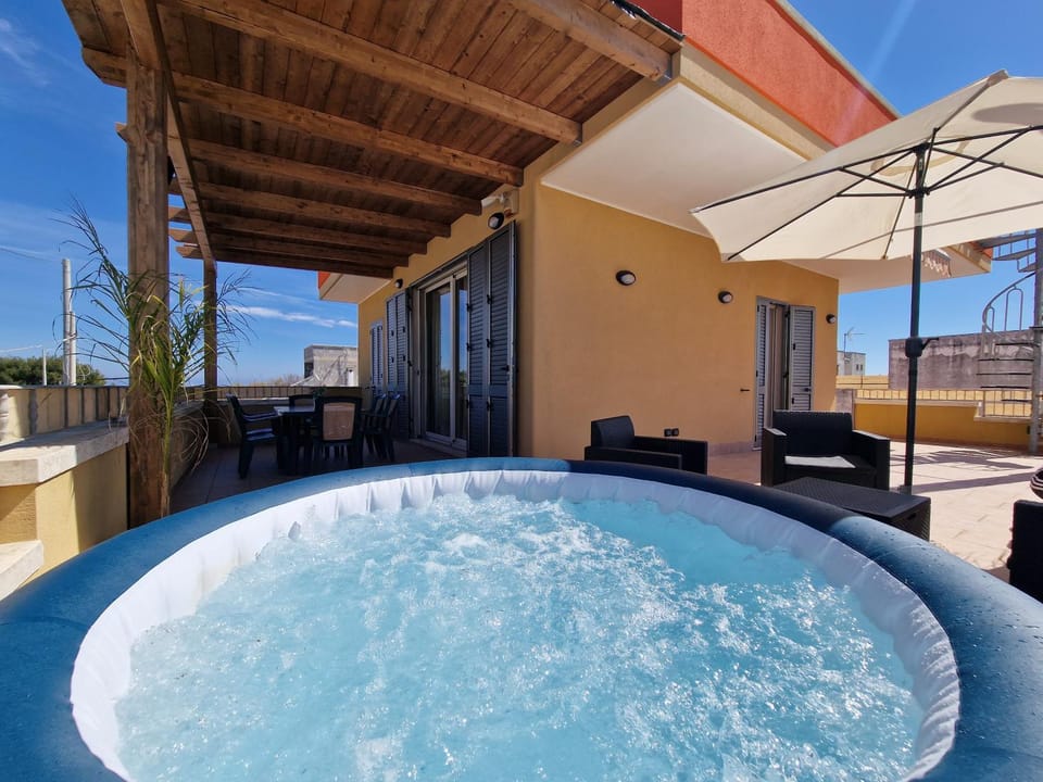 Property building, Patio, Hot Tub, Balcony/Terrace, Sea view, Swimming pool