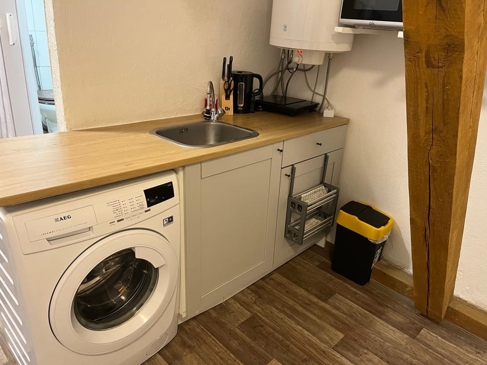 Kitchen or kitchenette, washing machine