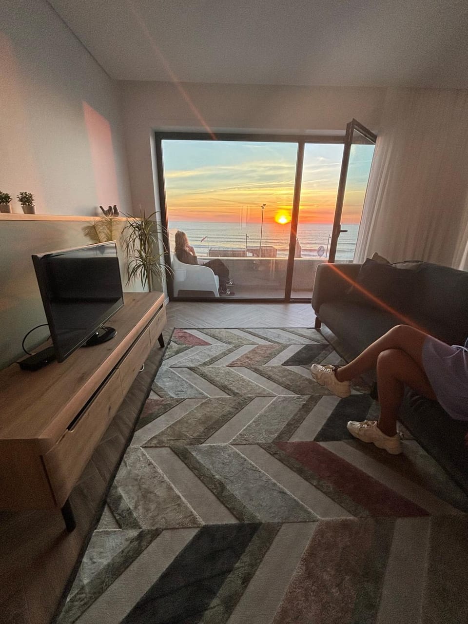 View (from property/room), Living room, Landmark view, Sea view, Sunset