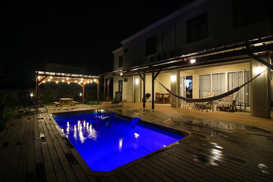 Property building, Patio, Night, Pool view, sunbed