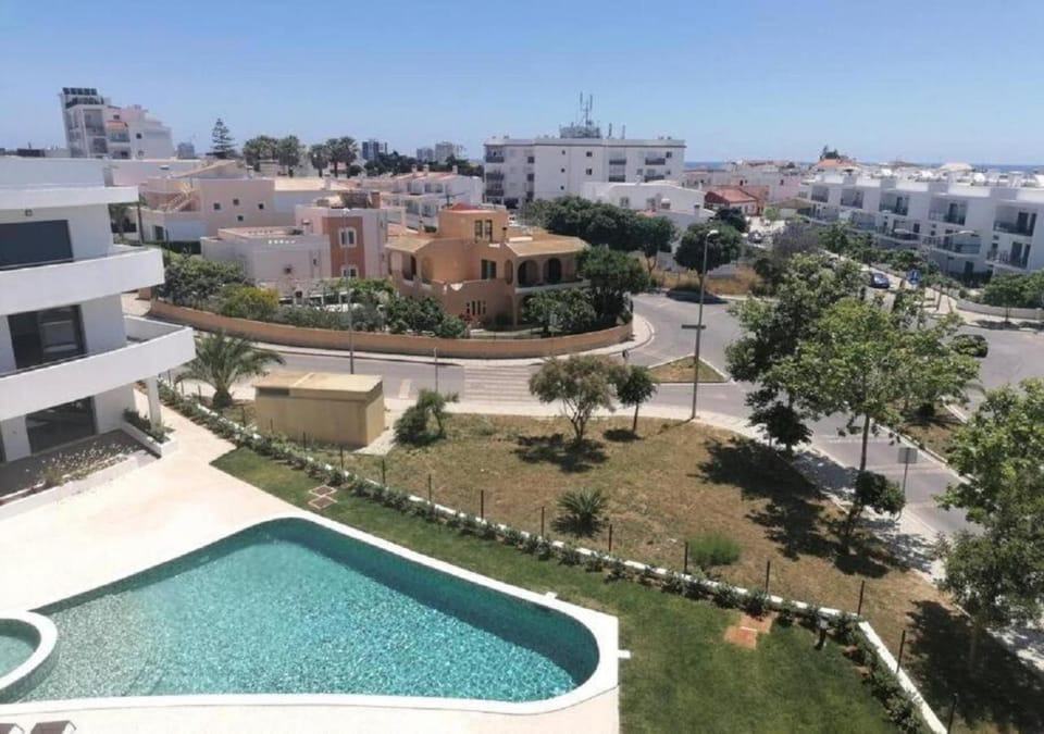 Property building, Day, City view, City view, Pool view, Pool view, Street view, Street view, Swimming pool, Location