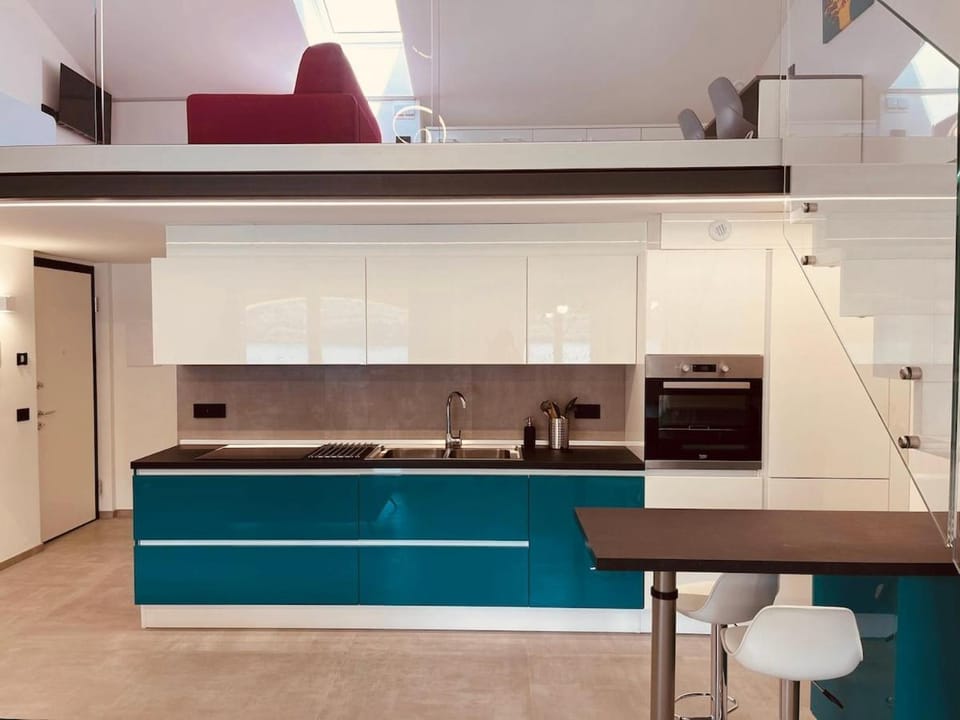 Kitchen or kitchenette, dishwasher, oven, stove