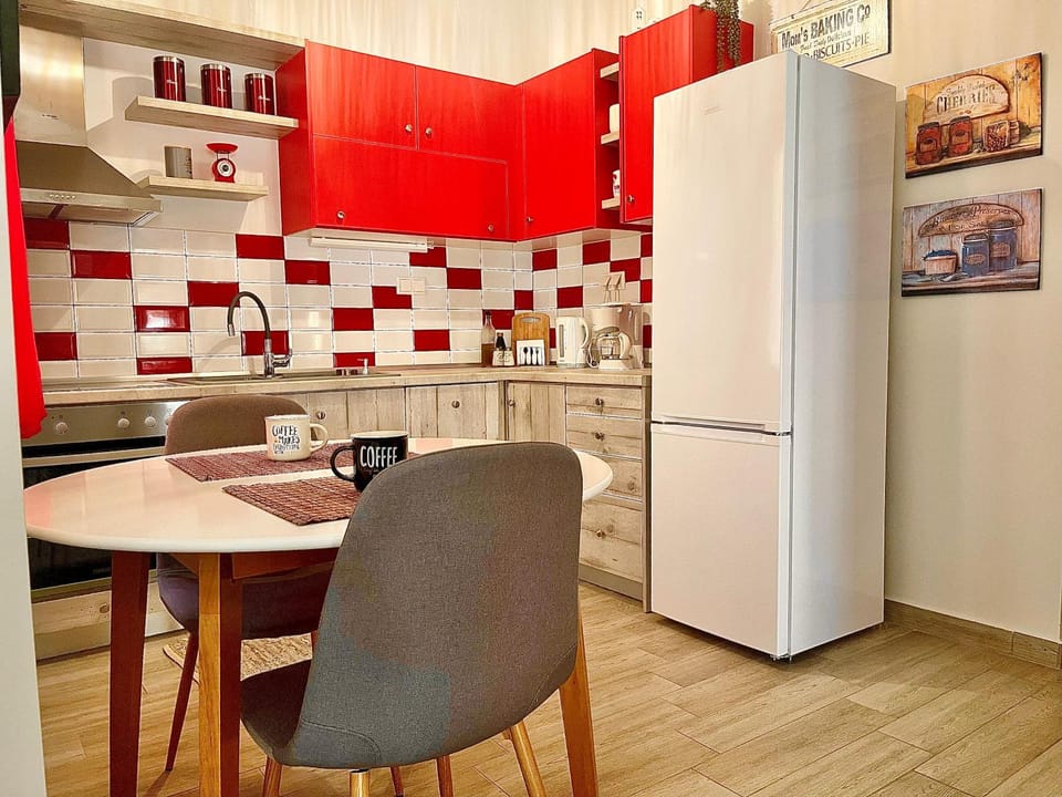 Kitchen or kitchenette, dishwasher, oven, stove