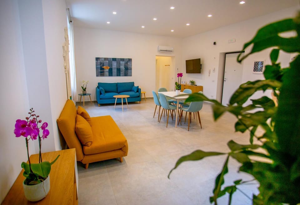 TV and multimedia, Living room, Photo of the whole room, Seating area, Floor plan, Dining area, stove, wardrobe, air conditioner