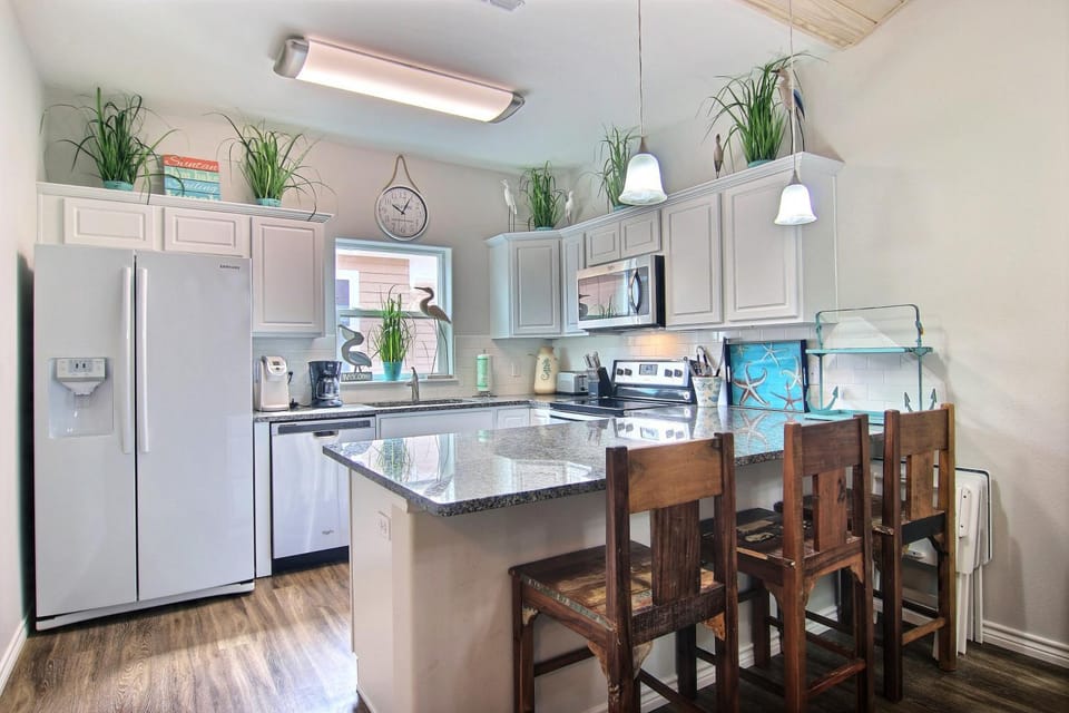 Kitchen or kitchenette, Seating area, Dining area, furniture, microwave, oven, stove