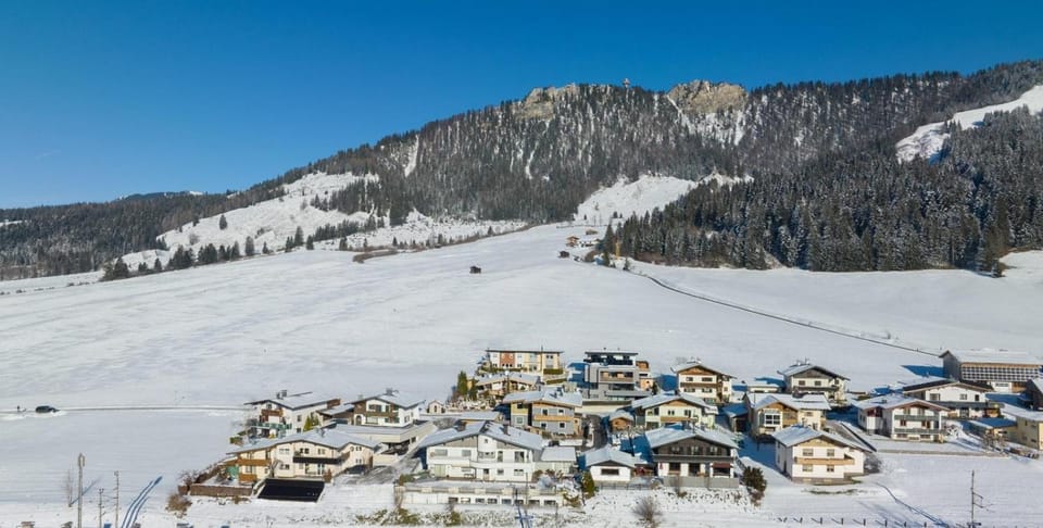 Property building, Nearby landmark, Day, Natural landscape, Winter, Mountain view