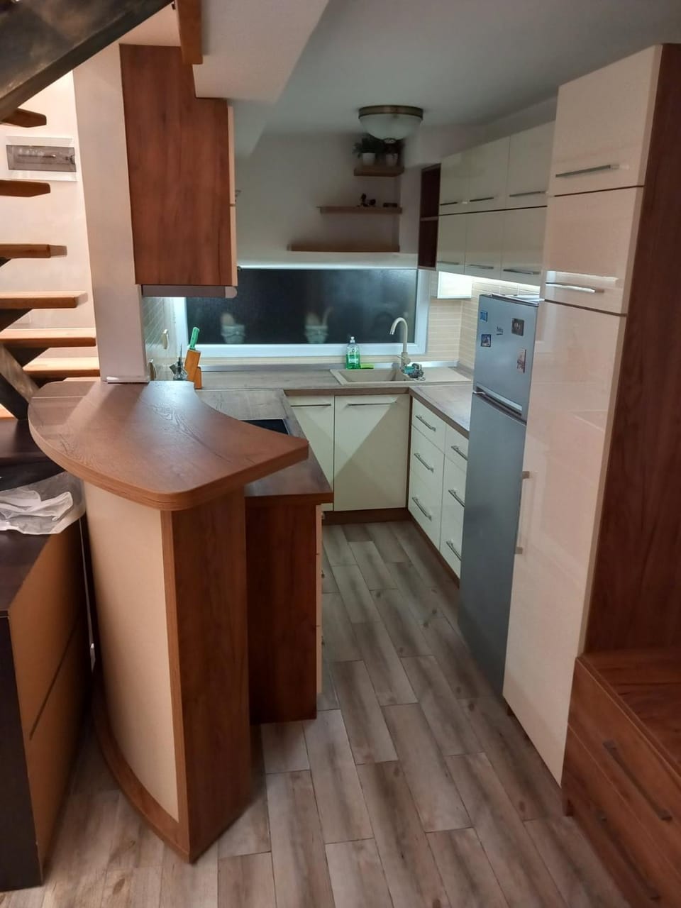 Kitchen or kitchenette, dishwasher, oven, stove