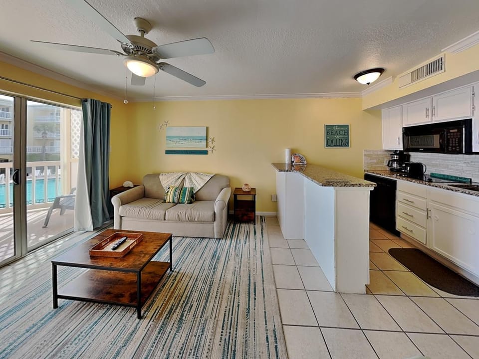 Kitchen or kitchenette, Living room, Pool view, furniture, microwave