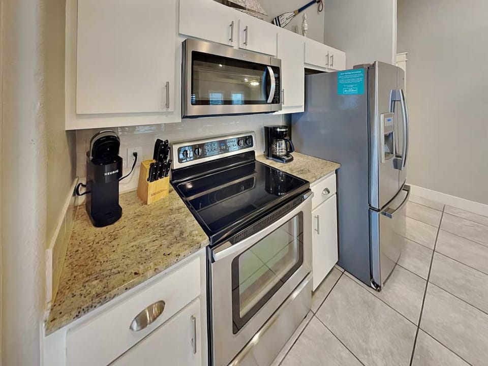 Kitchen or kitchenette, microwave, oven, stove, kitchen