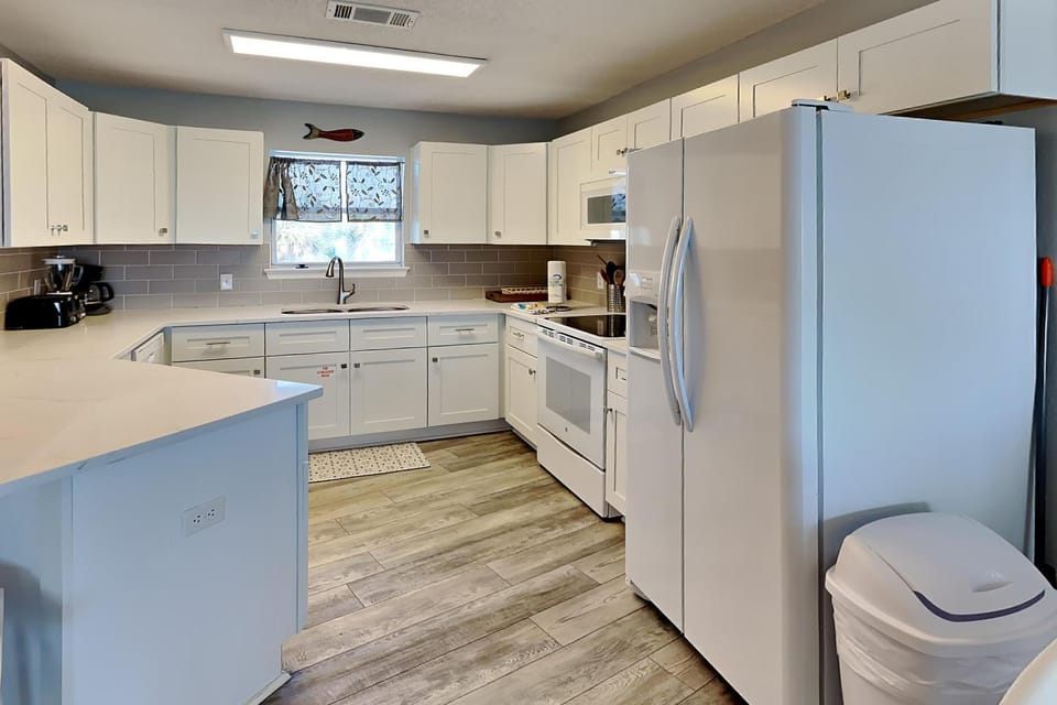 Kitchen or kitchenette, dishwasher, microwave, oven, stove, kitchen
