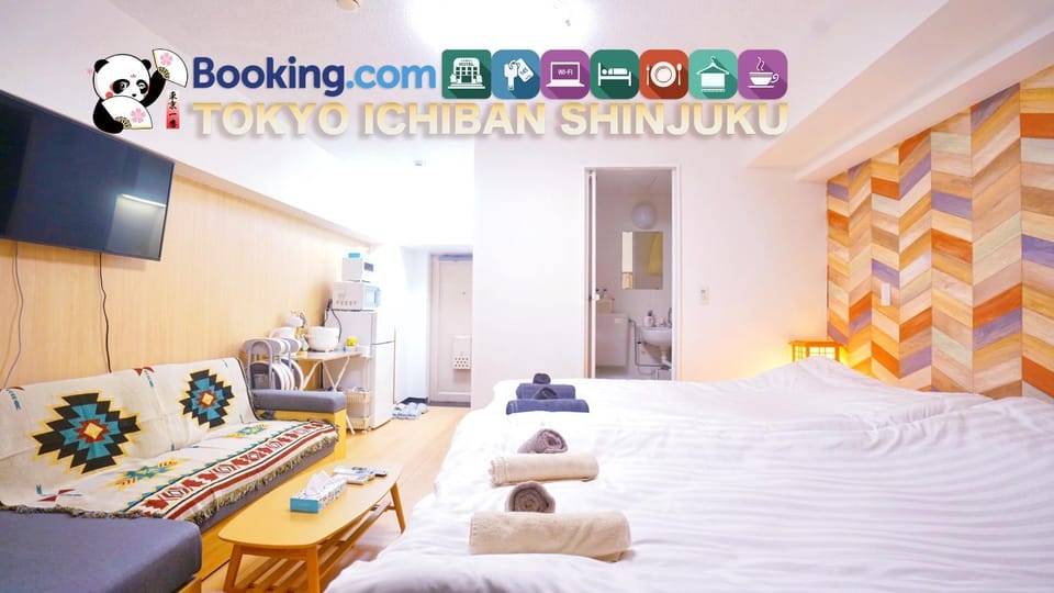 Bed, Property logo or sign, Property logo or sign, TV and multimedia, Photo of the whole room, Logo/Certificate/Sign, Bedroom, Text overlay