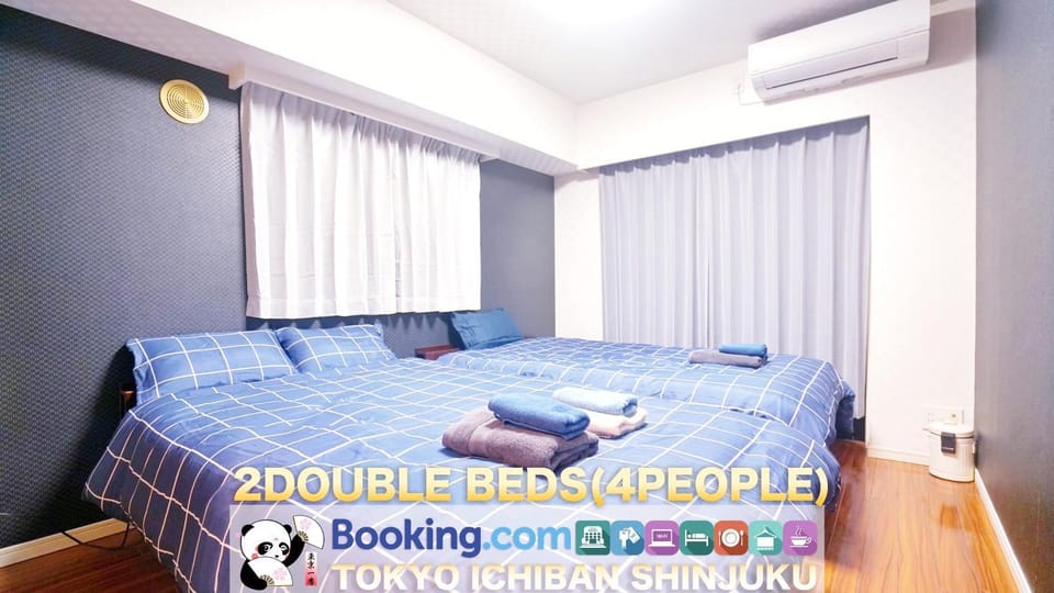 Bed, Property logo or sign, Photo of the whole room, Decorative detail, Decorative detail, Logo/Certificate/Sign, Bedroom, Text overlay, Certificate/Award, air conditioner, air conditioner