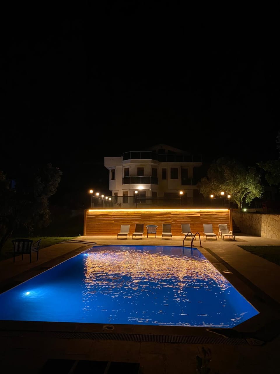 Patio, Night, Pool view, Swimming pool, sunbed