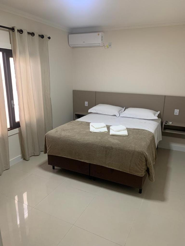 Bed, Photo of the whole room, Bedroom, towels, air conditioner