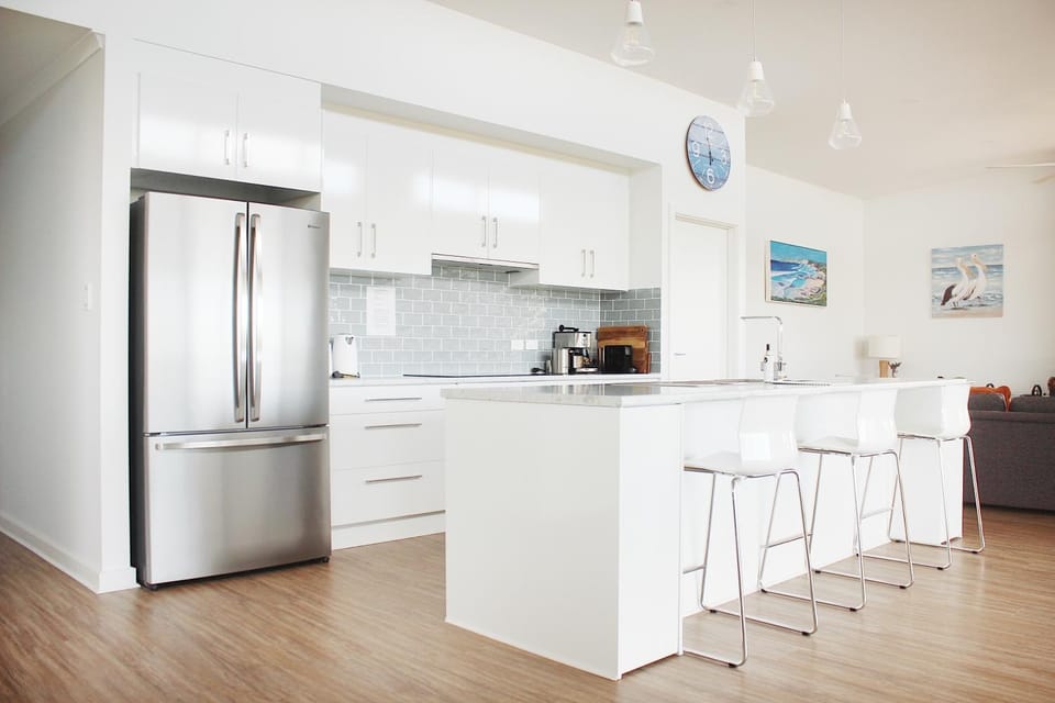 Kitchen or kitchenette, dishwasher, oven, stove
