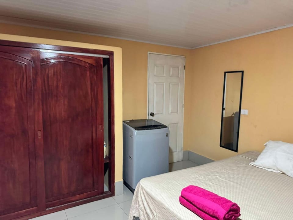 Bed, Bedroom, towels, wardrobe, washing machine
