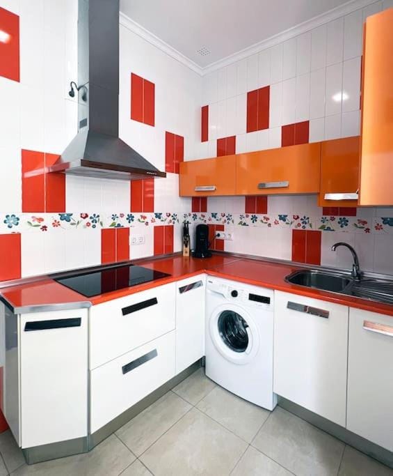 Kitchen or kitchenette, stove, washing machine
