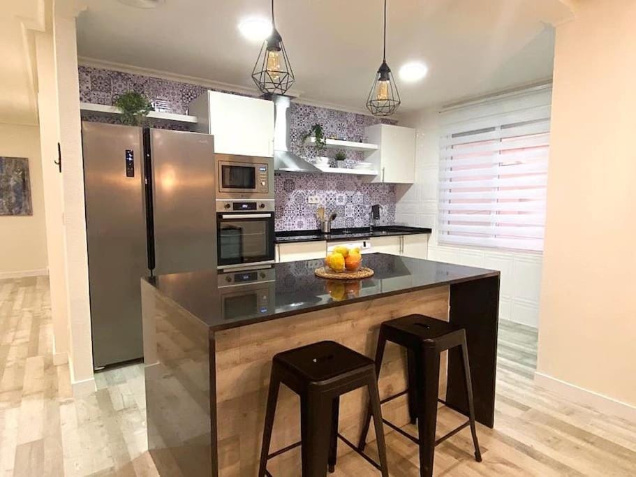 Kitchen or kitchenette, dishwasher, oven, stove
