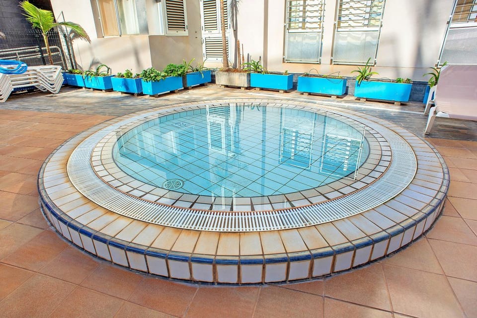 Property building, Living room, Swimming pool