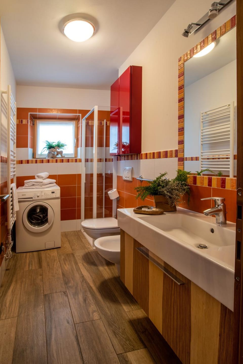 Toilet, Bathroom, bidet, towels, washing machine, dryer